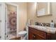 Bathroom featuring granite countertops, decorative mirror and bath/shower with decorative shower curtain at 3698 Lakeview Drive, Tucker, GA 30084