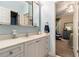 Well-lit bathroom with modern vanity, ample storage, and access to an adjacent bedroom at 3698 Lakeview Drive, Tucker, GA 30084