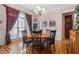 Formal dining room with wood floors, modern lighting, and large window at 3698 Lakeview Drive, Tucker, GA 30084