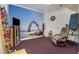 Bright exercise room with accent wall, fitness equipment, and comfortable seating at 3698 Lakeview Drive, Tucker, GA 30084