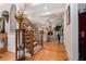Elegant foyer with hardwood floors, staircase, and an open view to the living room with a fireplace at 3698 Lakeview Drive, Tucker, GA 30084