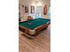 Game room with a billiard table, natural light, and luxury vinyl plank flooring at 3698 Lakeview Drive, Tucker, GA 30084