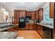 Well-equipped kitchen featuring granite countertops, stainless steel appliances, and custom cabinetry at 3698 Lakeview Drive, Tucker, GA 30084