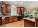 Updated kitchen featuring granite countertops, stainless steel appliances, tile backsplash, and ample storage at 3698 Lakeview Drive, Tucker, GA 30084