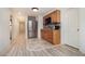 Modern kitchenette with stainless steel refrigerator, microwave, and wood cabinets at 3698 Lakeview Drive, Tucker, GA 30084