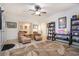 Comfortable living room featuring a patterned rug, two chairs, and themed decor at 3698 Lakeview Drive, Tucker, GA 30084