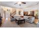 Spacious living room featuring hardwood floors, coffered ceilings, fireplace, and an open layout to the kitchen at 3698 Lakeview Drive, Tucker, GA 30084