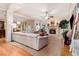 Open-concept living room boasts hardwood floors, a fireplace, coffered ceilings, and ample natural light at 3698 Lakeview Drive, Tucker, GA 30084