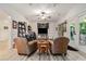 Inviting living room with natural light, ceiling fan, and an entertainment center at 3698 Lakeview Drive, Tucker, GA 30084