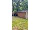 A view of the exterior of the home showing brick siding and the HVAC unit at 6197 Union Grove Rd, Lithia Springs, GA 30122