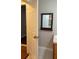 Bathroom with white vanity, mirror, and wood-look floors for a stylish space at 6197 Union Grove Rd, Lithia Springs, GA 30122