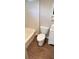 This bathroom features vinyl flooring, toilet, vanity, and tub with shower at 6197 Union Grove Rd, Lithia Springs, GA 30122