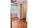 This bedroom features hardwood floors and a window, creating a comfortable atmosphere at 6197 Union Grove Rd, Lithia Springs, GA 30122