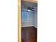 This bedroom features hardwood floors, a ceiling fan, and a window for a well-lit space at 6197 Union Grove Rd, Lithia Springs, GA 30122