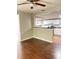 View of dining area with hardwood floors, a ceiling fan, and an open view into the kitchen at 6197 Union Grove Rd, Lithia Springs, GA 30122