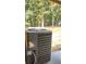 An exterior HVAC unit is surrounded by a yard and mature trees at 6197 Union Grove Rd, Lithia Springs, GA 30122