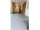 A view of a concrete backyard patio with a laundry room and brick siding at 6197 Union Grove Rd, Lithia Springs, GA 30122