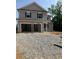 New two-story home featuring a two-car garage and classic curb appeal at 7226 Lacey Dr Lot 125 Dr, Douglasville, GA 30134