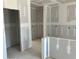 Kitchen view featuring a center island, drywall accents and a view to a doorway at 7226 Lacey Dr Lot 125 Dr, Douglasville, GA 30134