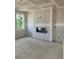 Bright living room with contemporary fireplace, offering a cozy and inviting space at 7226 Lacey Dr Lot 125 Dr, Douglasville, GA 30134