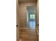 Hallway with hard surface floors that opens into a living area with lots of light at 3708 Cheswolde Ave # 95, Powder Springs, GA 30127