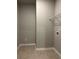Empty laundry room with tile flooring and one shelf installed at 3708 Cheswolde Ave # 95, Powder Springs, GA 30127