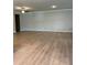 Spacious living room featuring hardwood floors and plenty of natural light at 3708 Cheswolde Ave # 95, Powder Springs, GA 30127