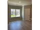 Open-concept living space with hardwood floors, natural light and neutral color palette at 3708 Cheswolde Ave # 95, Powder Springs, GA 30127