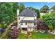 Aerial view of the backyard, showing the patio, deck, garden, and home architecture at 5833 Wembley Dr, Douglasville, GA 30135
