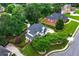 Overhead shot of landscaped property with mature trees, showcasing home's architectural features at 5833 Wembley Dr, Douglasville, GA 30135