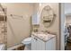 Bathroom featuring sink vanity with stone countertop, cabinet, modern mirror, toilet and shower at 5833 Wembley Dr, Douglasville, GA 30135