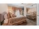 Comfortable bedroom with carpeted floors, decorative bedspread and mirrored closet at 5833 Wembley Dr, Douglasville, GA 30135