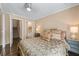 Bright bedroom featuring carpeted floors, with ensuite bathroom, and stairs to next level at 5833 Wembley Dr, Douglasville, GA 30135