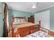 Bedroom with hardwood floors, a large bed, and a double door closet at 5833 Wembley Dr, Douglasville, GA 30135