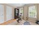 Bedroom with carpet, two windows with blinds, and a workout treadmill at 5833 Wembley Dr, Douglasville, GA 30135