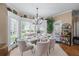 Bright dining room with large windows, chandelier, and comfortable seating at 5833 Wembley Dr, Douglasville, GA 30135