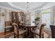 Formal dining room features elegant chandelier and wainscoting at 5833 Wembley Dr, Douglasville, GA 30135