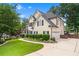 Well-maintained home with attached garage and manicured lawn at 5833 Wembley Dr, Douglasville, GA 30135