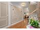 Elegant foyer featuring decorative wall molding, hardwood floors, and a glimpse of the living room at 5833 Wembley Dr, Douglasville, GA 30135