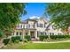Stately two-story home features manicured lawn and mature trees at 5833 Wembley Dr, Douglasville, GA 30135