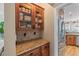 Butler's pantry boasts granite counters, stainless steel appliances, and custom cabinets at 5833 Wembley Dr, Douglasville, GA 30135
