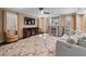 Cozy living room with modern furniture, fireplace, decorative bar, and TV at 5833 Wembley Dr, Douglasville, GA 30135