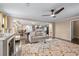 Spacious living area with modern furnishings, fireplace, and open access to the kitchen and pool table at 5833 Wembley Dr, Douglasville, GA 30135