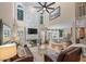 Open-concept living room with fireplace, hardwood floors, and ample natural light at 5833 Wembley Dr, Douglasville, GA 30135