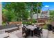 Inviting patio with comfortable seating around a fire pit and beautiful landscaping at 5833 Wembley Dr, Douglasville, GA 30135