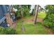 Landscaped backyard with a gentle slope and wooden steps leading to the lakefront at 6381 Lakeview Dr, Buford, GA 30518