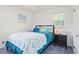 Comfortable bedroom with natural light, featuring a queen-sized bed and stylish nightstand at 6381 Lakeview Dr, Buford, GA 30518