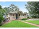 Cozy home with a well-manicured lawn and brick path leading to the entrance at 6381 Lakeview Dr, Buford, GA 30518