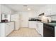 Well-lit kitchen with white cabinets, green countertops, and modern appliances for an efficient cooking space at 6381 Lakeview Dr, Buford, GA 30518