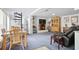 Open-concept living room featuring a fireplace, spiral staircase, and comfortable seating area at 6381 Lakeview Dr, Buford, GA 30518